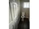 Compact bathroom design that features a toilet, window, and neutral wall paint at 2312 Tate St, Charlotte, NC 28216