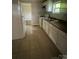 Functional kitchen with white cabinets, efficient appliances, and ample counter space at 2312 Tate St, Charlotte, NC 28216