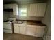 Practical kitchen showcasing ample cabinets, laminate countertops, and standard appliances at 2312 Tate St, Charlotte, NC 28216