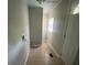 Practical laundry area with connections for washer and dryer, tile flooring, and ample space at 2312 Tate St, Charlotte, NC 28216