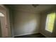 Neutral room showcasing a freshly painted interior and a bright window at 2312 Tate St, Charlotte, NC 28216