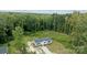 Overhead view of a single-story home with green trees, surrounded by a yard at 253 Artemis Pl # 27, Kershaw, SC 29067