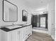 Bathroom featuring a double vanity, framed mirrors and a glass-enclosed shower at 253 Artemis Pl # 27, Kershaw, SC 29067