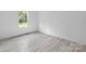 Bright bedroom with a large window, neutral walls, and wood-look flooring at 253 Artemis Pl # 27, Kershaw, SC 29067