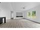 Bright living room boasts modern floors, a ceiling fan, and an entertainment center for cozy relaxation at 253 Artemis Pl # 27, Kershaw, SC 29067