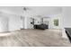 Open-concept living area seamlessly flows into the kitchen, featuring modern floors and ample natural light at 253 Artemis Pl # 27, Kershaw, SC 29067