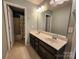 Bathroom featuring double sink vanity, tiled floor, and shower at 2741 Smethwick Ln, Gastonia, NC 28056