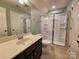 Bathroom vanity with framed shower and tile flooring at 2741 Smethwick Ln, Gastonia, NC 28056