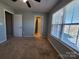 Carpeted bedroom with window and neutral paint at 2741 Smethwick Ln, Gastonia, NC 28056