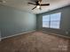 Bedroom with neutral paint, ceiling fan, and carpet at 2741 Smethwick Ln, Gastonia, NC 28056
