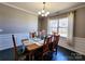 Formal dining room with a chandelier, wainscoting and hardwood floors at 2741 Smethwick Ln, Gastonia, NC 28056