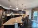 Eat-in kitchen featuring stainless steel appliances, dark cabinets, and granite countertops at 2741 Smethwick Ln, Gastonia, NC 28056