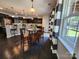 Open concept kitchen with dark cabinets, granite countertops, and dining area at 2741 Smethwick Ln, Gastonia, NC 28056