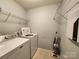 Laundry room with washer, dryer and shelving at 2741 Smethwick Ln, Gastonia, NC 28056