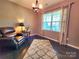 Warm living room featuring hardwood floors, a reading nook and natural lighting at 2741 Smethwick Ln, Gastonia, NC 28056