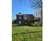Image of a wooden deck with stairs in the backyard and a grassy lawn at 307 Gold Hill Ave, Rockwell, NC 28138