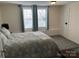 Inviting bedroom with soft lighting, featuring neutral tones, carpet, and a comfortable bed at 307 Gold Hill Ave, Rockwell, NC 28138