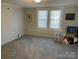 Carpeted bedroom with neutral paint, featuring natural light from the window at 307 Gold Hill Ave, Rockwell, NC 28138
