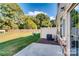 Fenced backyard with sliding door and patio at 319 Pond Place Ln, Matthews, NC 28104
