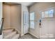 Inviting entryway with staircase and natural light at 319 Pond Place Ln, Matthews, NC 28104