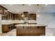 Gourmet kitchen featuring a spacious island, granite countertops, and modern stainless steel appliances at 319 Pond Place Ln, Matthews, NC 28104
