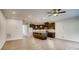 Spacious and open floor plan, with modern hardwood floors, connecting the kitchen and living area at 319 Pond Place Ln, Matthews, NC 28104