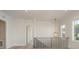 Hallway with a pendant light, hardwood floors, and white walls with white trim at 3200 Providence Rd # 1B, Charlotte, NC 28211