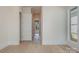 Bright hallway featuring hardwood floors, white trim and doors, and recessed lighting at 3200 Providence Rd # 1B, Charlotte, NC 28211