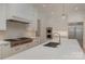 Bright white kitchen with a large island, stainless steel appliances, and modern finishes at 3200 Providence Rd # 1B, Charlotte, NC 28211