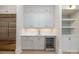 Modern kitchen includes stainless steel appliances, a wine fridge and custom cabinetry at 3200 Providence Rd # 1B, Charlotte, NC 28211