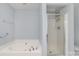 Bright bathroom featuring separate tub and shower with glass door at 321 Rose Garden Ct, Rock Hill, SC 29732