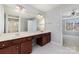 Bathroom featuring double sinks, vanity, and walk-in shower at 321 Rose Garden Ct, Rock Hill, SC 29732