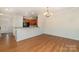 Well-lit dining area with hardwood floors and open access to the kitchen space at 321 Rose Garden Ct, Rock Hill, SC 29732