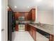 Well-lit kitchen featuring granite countertops, stainless steel appliances, and tile flooring at 321 Rose Garden Ct, Rock Hill, SC 29732