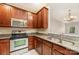 Kitchen showcasing stainless steel appliances and beautiful wood cabinets at 321 Rose Garden Ct, Rock Hill, SC 29732