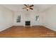 Inviting living space with hardwood flooring, a charming fireplace, and ample natural light at 321 Rose Garden Ct, Rock Hill, SC 29732