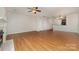 Open-concept living space featuring wood floors, a fireplace, and seamless flow to dining and kitchen areas at 321 Rose Garden Ct, Rock Hill, SC 29732