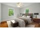 Comfortable bedroom featuring a ceiling fan and natural light from two windows at 3221 Cosby Pl, Charlotte, NC 28205