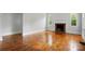 Bright living room featuring hardwood floors and a fireplace at 3221 Cosby Pl, Charlotte, NC 28205