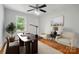 Bright office space with a large desk, comfortable seating, and a ceiling fan at 3221 Cosby Pl, Charlotte, NC 28205
