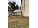 Backyard shot with a dog kennel and a shed at 3260 Reepsville Rd, Lincolnton, NC 28092