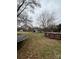 Wide shot of the backyard featuring a trampoline and an above-ground pool at 3260 Reepsville Rd, Lincolnton, NC 28092