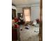 Bedroom with white paneled walls, a window, and a full sized bed at 3260 Reepsville Rd, Lincolnton, NC 28092