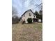 Two-story home with a covered porch and overgrown yard at 3260 Reepsville Rd, Lincolnton, NC 28092