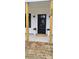 A close-up of the front door of home with porch columns and plants, and the house number is visible at 330 Fiber Acres A St, Cleveland, NC 27013