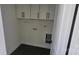 Convenient laundry room with upper cabinets and washer/dryer hookups at 330 Fiber Acres A St, Cleveland, NC 27013