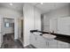 Contemporary bathroom featuring double sinks, granite countertop, and a sleek glass-enclosed shower at 333 W Trade St # 2704, Charlotte, NC 28202