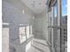 Bright bathroom featuring marble tile, a soaking tub, and a glass-enclosed shower at 333 W Trade St # 2704, Charlotte, NC 28202