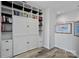 Charming bedroom featuring custom built-in shelving and stylish wood-look flooring at 333 W Trade St # 2704, Charlotte, NC 28202