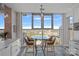 Inviting breakfast nook with stunning views of the cityscape through large windows at 333 W Trade St # 2704, Charlotte, NC 28202